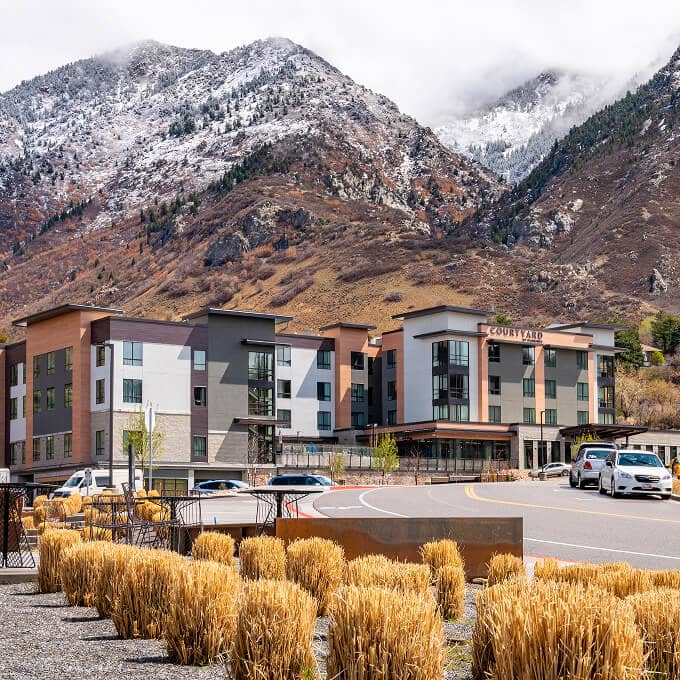 Courtyard Hotel exterior view with mountains in the background