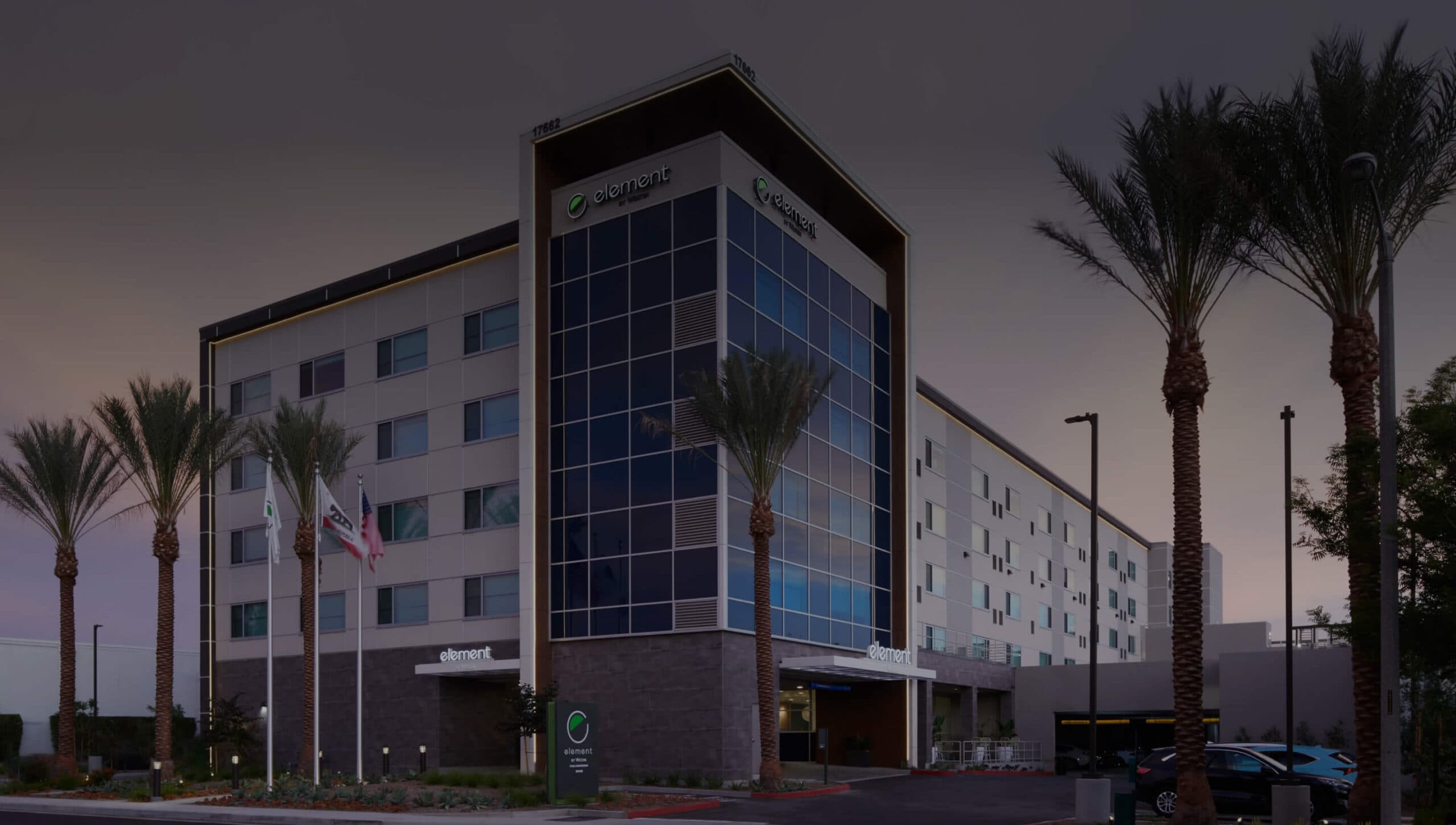 Image of Element Hotel front view with dark overlay
